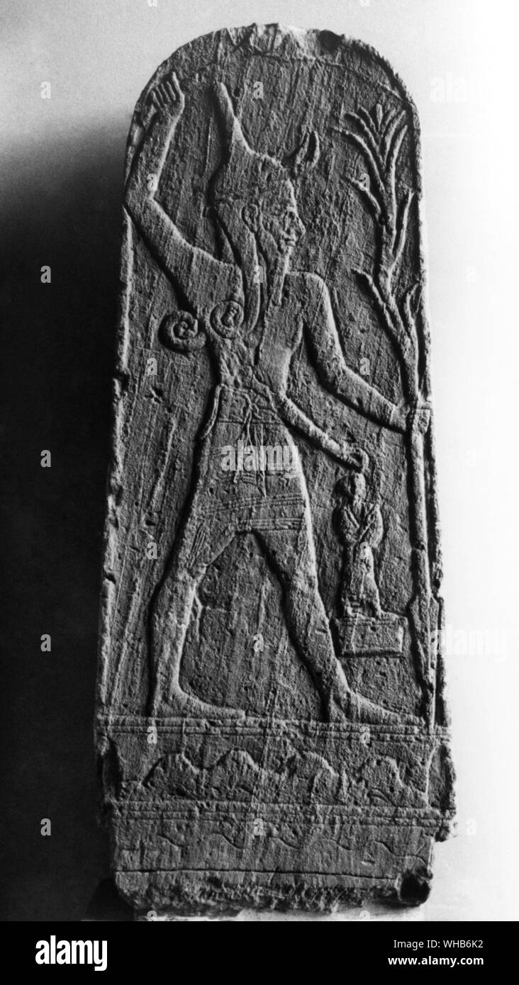 Baal, a relief from Ugarit (Ras Shamra) 18-19th century BC.. Ba`al (often spelled Baal) is a Northwest Semitic title and honorific meaning master or lord that is used for various gods who were patrons of cities in the Babylon, cognate to Assyrian Belu. . Stock Photo